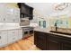Gourmet kitchen features an island, stainless steel appliances, granite counters, and custom cabinets at 860 Chatham Hills Blvd, Westfield, IN 46074
