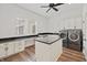 Bright laundry room featuring modern washer and dryer, ample counter space, and a convenient center island at 860 Chatham Hills Blvd, Westfield, IN 46074