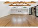 Living room boasts exposed beams, custom built-ins, hardwood floors, and access to the outdoor patio at 860 Chatham Hills Blvd, Westfield, IN 46074