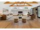 Spacious living room with exposed wood beams, custom built-ins, hardwood floors, and modern furnishings at 860 Chatham Hills Blvd, Westfield, IN 46074