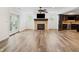 Spacious living room features a fireplace, ceiling fan, and wood floors at 860 Chatham Hills Blvd, Westfield, IN 46074