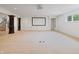Spacious living room features a movie screen, white cabinets and staircase access at 860 Chatham Hills Blvd, Westfield, IN 46074