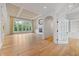 Spacious living room featuring a fireplace, hardwood floors, large windows and coffered ceilings at 860 Chatham Hills Blvd, Westfield, IN 46074
