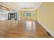 Living room features yellow walls, coffered ceilings, hardwood floors, and access to the outdoor patio at 860 Chatham Hills Blvd, Westfield, IN 46074