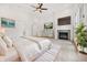 Bright main bedroom boasts a cozy fireplace, neutral decor, and tray ceilings adding architectural interest at 860 Chatham Hills Blvd, Westfield, IN 46074