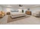 Bright main bedroom featuring tray ceilings, a ceiling fan, and neutral furnishings at 860 Chatham Hills Blvd, Westfield, IN 46074