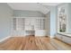 Bright office space with built-in shelving, a window seat, and hardwood flooring at 860 Chatham Hills Blvd, Westfield, IN 46074