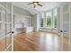 Bright office space with built-in bookshelves, a window seat, and hardwood flooring at 860 Chatham Hills Blvd, Westfield, IN 46074