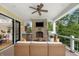 Inviting outdoor patio featuring a fireplace, TV, built-in grill, and comfortable wicker seating area at 860 Chatham Hills Blvd, Westfield, IN 46074