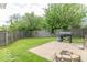 The back yard includes a grill, fire pit, patio, and wooden perimeter fence at 8712 Mellot Way, Camby, IN 46113