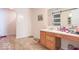 Bathroom with wood vanity, sink, and a mirror with a sliding glass door at 8712 Mellot Way, Camby, IN 46113