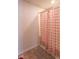 Bathroom featuring a shower with a red and white checkered shower curtain at 8712 Mellot Way, Camby, IN 46113