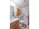 Bathroom with tile floor features a shower-tub combo and a wooden cabinet at 8712 Mellot Way, Camby, IN 46113