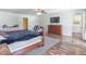 Primary bedroom featuring a wood bed frame, wood floors, and ample space at 8712 Mellot Way, Camby, IN 46113