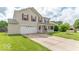 This lovely home boasts a spacious driveway, a well-manicured lawn, and inviting curb appeal at 8712 Mellot Way, Camby, IN 46113