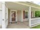 The covered front porch is perfect for relaxing with its charming porch swing and welcoming entrance at 8712 Mellot Way, Camby, IN 46113