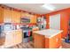 Efficient kitchen featuring wood cabinets, stainless steel appliances, and a functional center island at 8712 Mellot Way, Camby, IN 46113