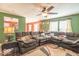 Spacious living room with comfortable sectional sofa, large windows, and a stylish area rug at 8712 Mellot Way, Camby, IN 46113