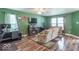Cozy living room featuring neutral colored furniture, hardwood floors and ample space at 8712 Mellot Way, Camby, IN 46113