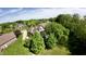 Beautiful aerial view showcases a home nestled among mature trees, blending luxury with nature at 897 Copperwood Dr, Carmel, IN 46033