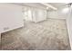 Open basement featuring neutral carpeting, white walls, recessed lighting, and access to a bathroom at 897 Copperwood Dr, Carmel, IN 46033