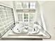 Sunlit bathroom featuring a modern bathtub and stylish fixtures at 897 Copperwood Dr, Carmel, IN 46033