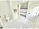 Sleek bathroom with marble floors, toilet, and shower at 897 Copperwood Dr, Carmel, IN 46033