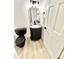 Modern half bathroom featuring a black toilet, a cabinet sink, and a black framed mirror at 897 Copperwood Dr, Carmel, IN 46033