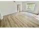 Spacious bedroom with hardwood floors and a large window providing natural light for a serene and comfortable ambiance at 897 Copperwood Dr, Carmel, IN 46033