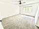 Bright bedroom with neutral carpet, ceiling fan and window at 897 Copperwood Dr, Carmel, IN 46033