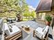 Inviting deck with outdoor seating and lush greenery creating a serene relaxation spot at 897 Copperwood Dr, Carmel, IN 46033