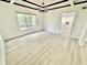 Bright and modern dining room with wood floors and window overlooking the back yard at 897 Copperwood Dr, Carmel, IN 46033