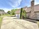 Long driveway leading to a two-car garage, set amidst a beautifully landscaped yard at 897 Copperwood Dr, Carmel, IN 46033