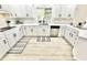 Well-lit kitchen features modern appliances, white cabinetry, and quartz countertops at 897 Copperwood Dr, Carmel, IN 46033