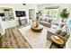 Bright and airy living room with hardwood floors, a cozy sofa, and built-in shelving for a relaxed lifestyle at 897 Copperwood Dr, Carmel, IN 46033