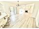 Open floor plan featuring living room and kitchen area with wood floors and fireplace at 897 Copperwood Dr, Carmel, IN 46033