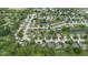 Sprawling aerial view of a residential community featuring multiple ponds and green spaces at 905 Congressional Way, Shelbyville, IN 46176