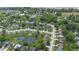 Lush aerial view of a neighborhood with mature trees and a serene pond at 905 Congressional Way, Shelbyville, IN 46176