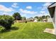Expansive backyard with mature trees and well manicured lawn at 905 Congressional Way, Shelbyville, IN 46176