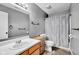 Bathroom with vanity, toilet, framed mirror, and shower with modern gray and white accents at 905 Congressional Way, Shelbyville, IN 46176