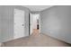 Neutral bedroom showcasing a door to a closet, door to bath, and neutral color palette at 905 Congressional Way, Shelbyville, IN 46176