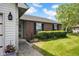 Charming brick home featuring well-maintained landscaping and a welcoming entrance at 905 Congressional Way, Shelbyville, IN 46176