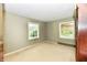 Bedroom with neutral walls, carpeted floor, closet and natural light from the two windows at 9098 W 1050 N, Elwood, IN 46036