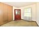 Bedroom with carpeted floor, closet, china cabinet, and natural light streaming through the window at 9098 W 1050 N, Elwood, IN 46036