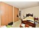 Bedroom with a built-in closet, a wooden bed frame, and ample storage space for an organized living at 9098 W 1050 N, Elwood, IN 46036