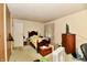 Bedroom with a wooden bed frame, a chest of drawers and ample natural light from a window at 9098 W 1050 N, Elwood, IN 46036