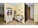 Hallway with built in shelving and vintage furniture leading to rooms in the home at 9098 W 1050 N, Elwood, IN 46036