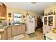 Functional kitchen with white appliances, ample counter space, and natural light from a window at 9098 W 1050 N, Elwood, IN 46036