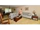 Inviting living room with neutral-toned sofas, wooden furniture, and a view of the dining area at 9098 W 1050 N, Elwood, IN 46036