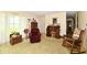 Comfortable living area featuring a rocking chair, desk and bureau, and a large window at 9098 W 1050 N, Elwood, IN 46036